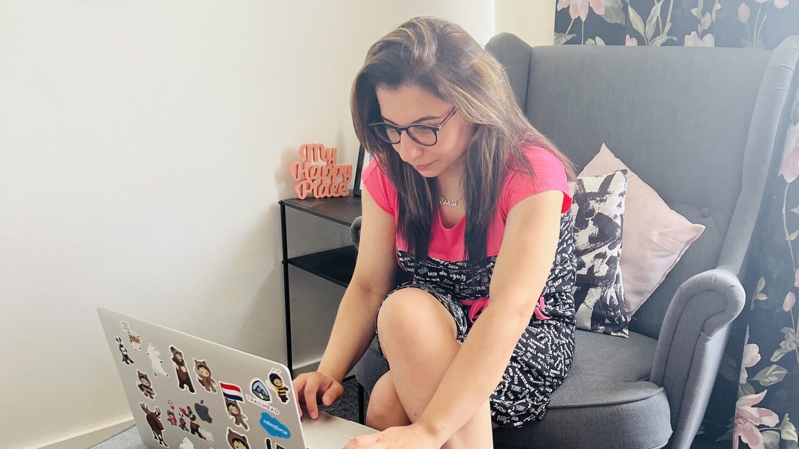 Swati working on her laptop at home